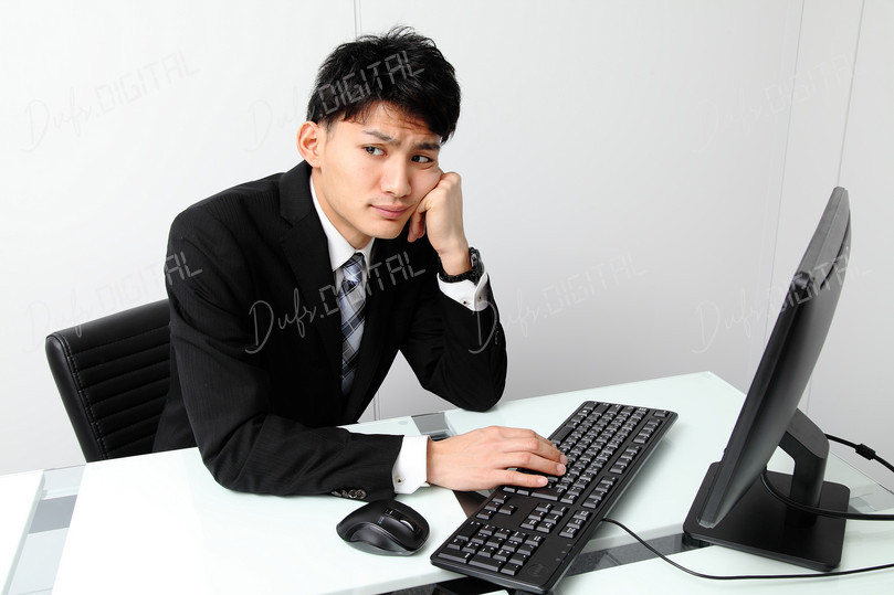 Frustrated Businessman at Desk