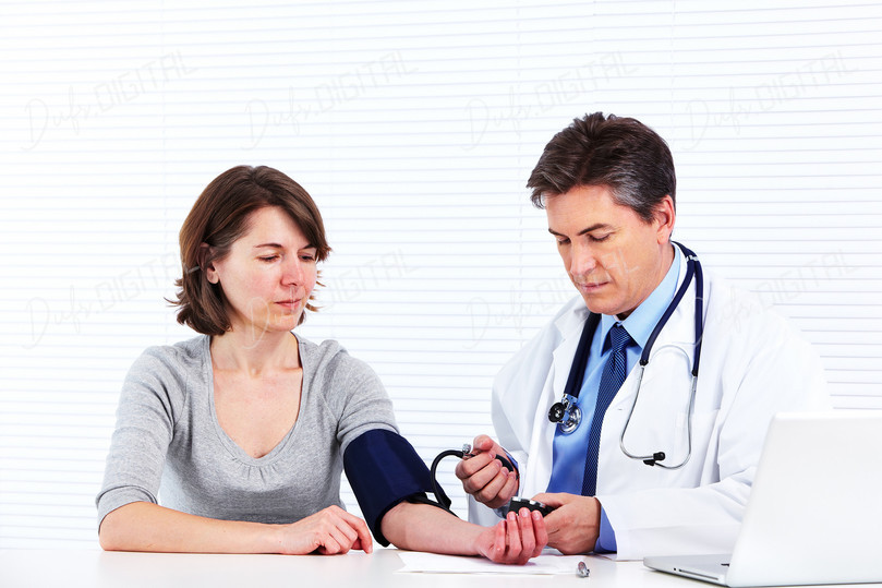 Doctor Checking Blood Pressure