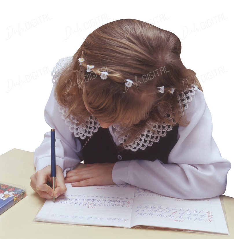 Child Writing in Notebook