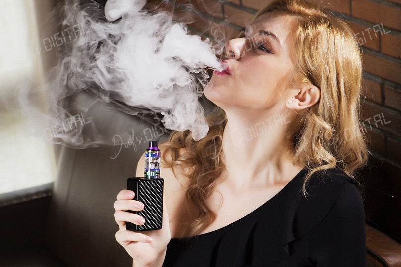 Woman Vaping Indoors