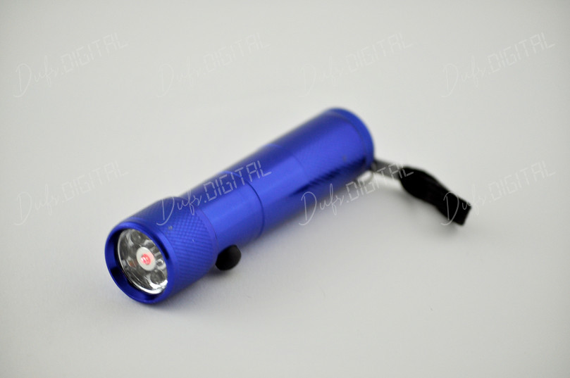 Blue Flashlight on Surface