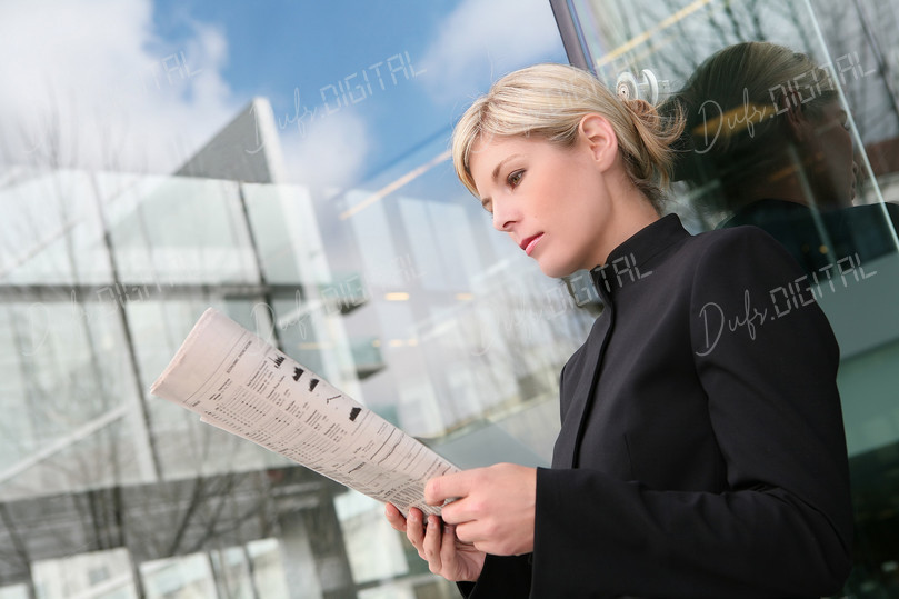 Woman Reading Newspaper