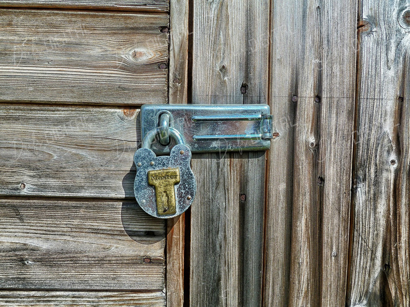 Rusty Padlock on Wood