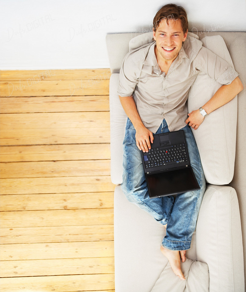 Smiling Man with Laptop
