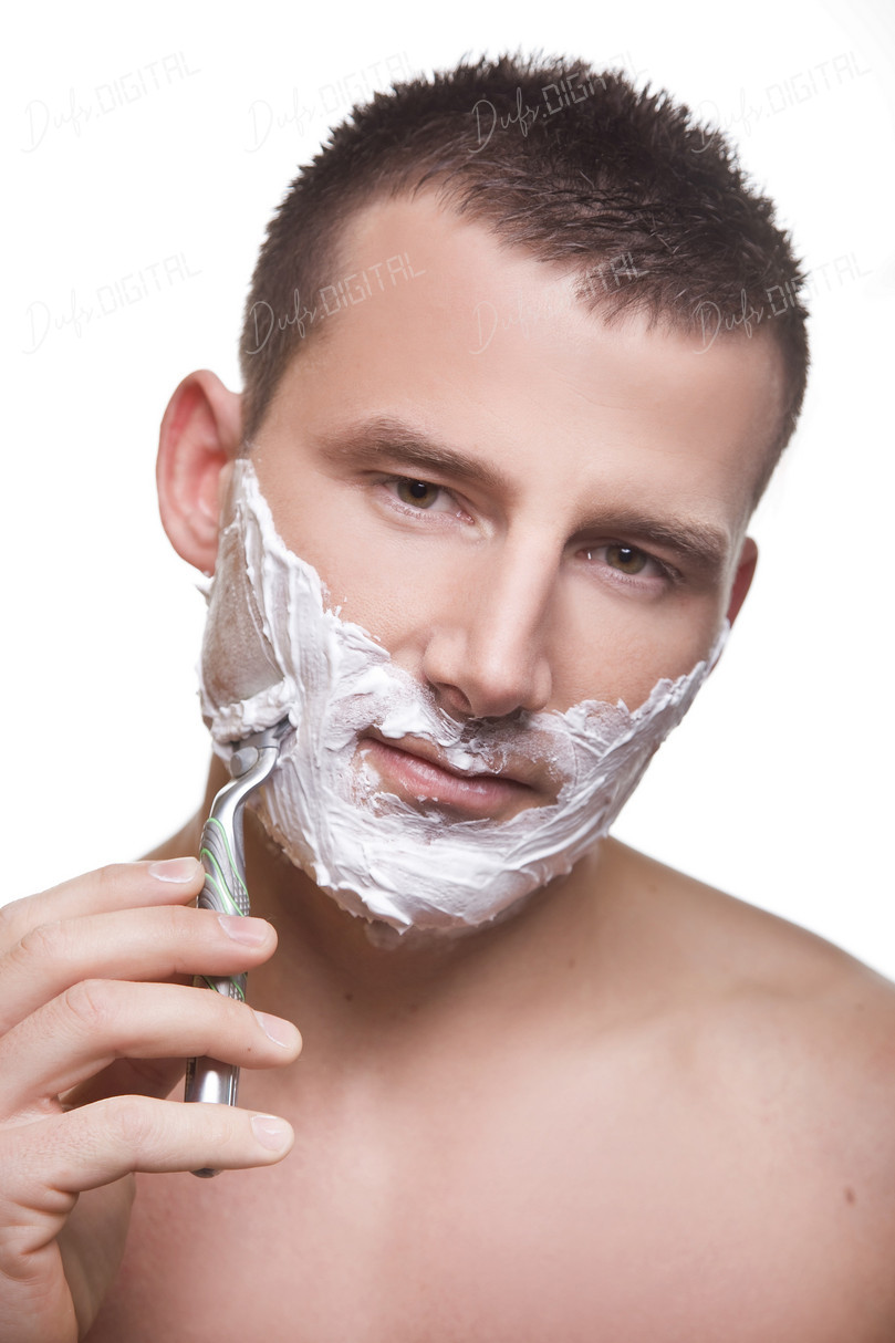 Man Shaving His Face