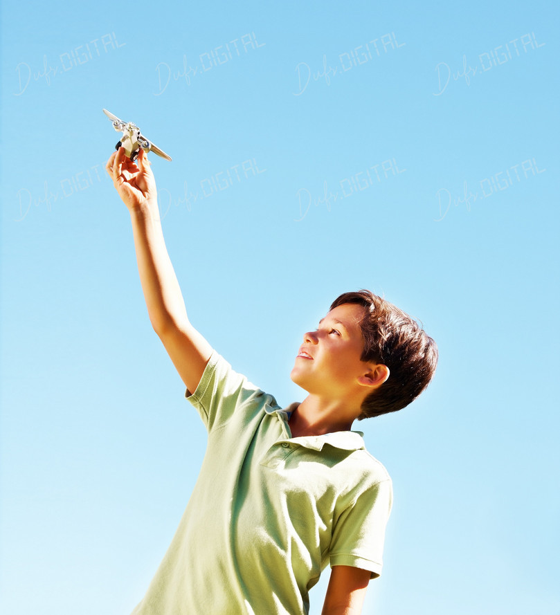 Child Playing with Airplane