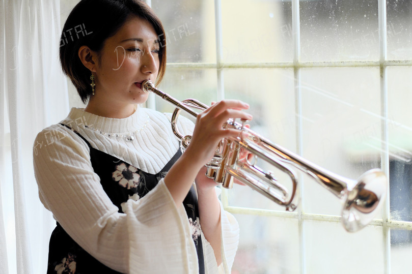 Woman Playing Trumpet