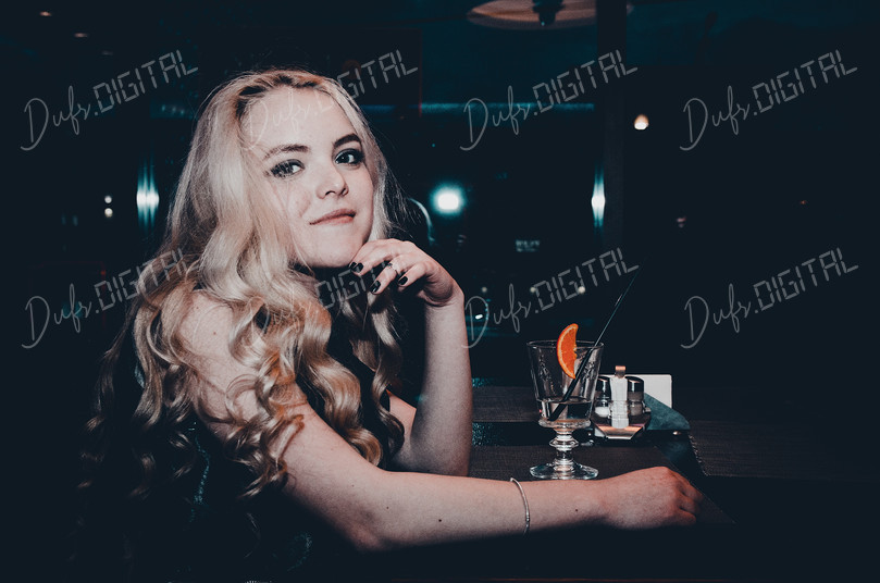 Charming Woman at Bar