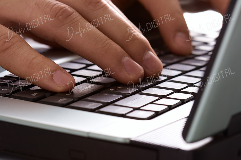 Typing on Laptop