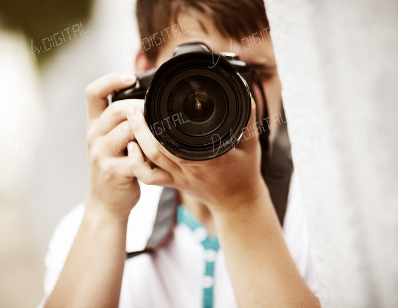 Young Photographer Capturing Moment