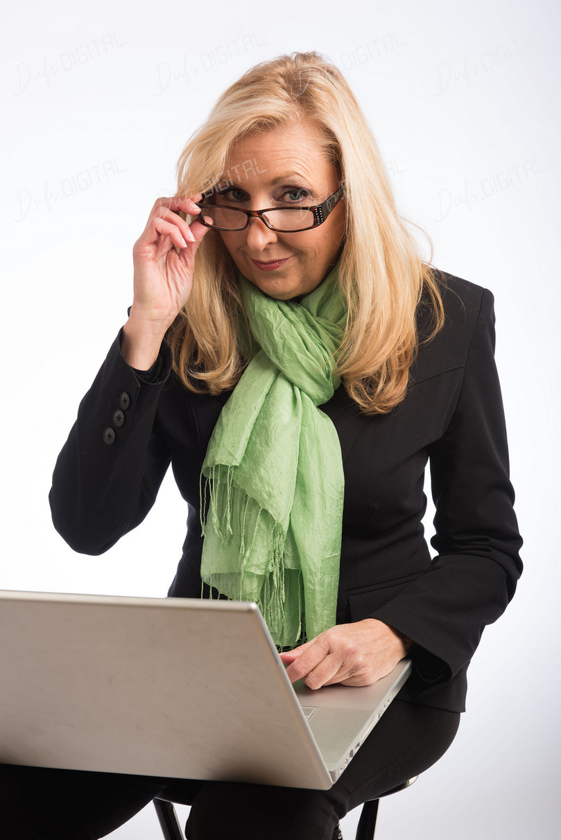 Confident Businesswoman with Laptop