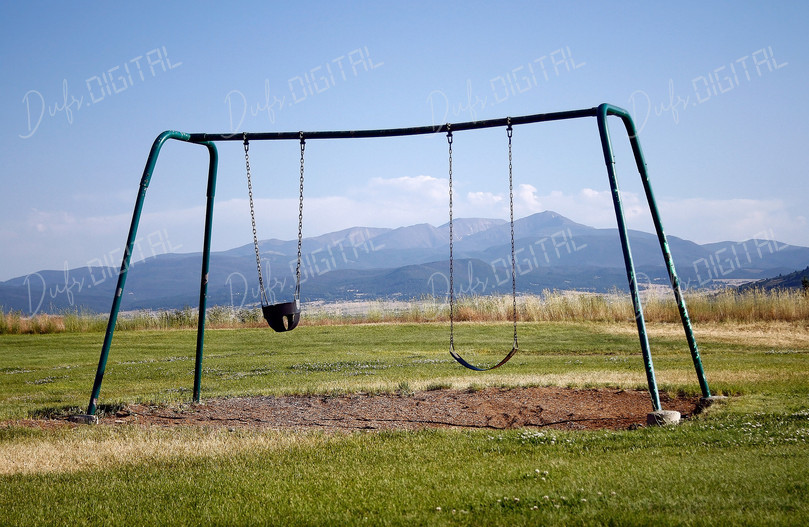 Empty Playground Swing