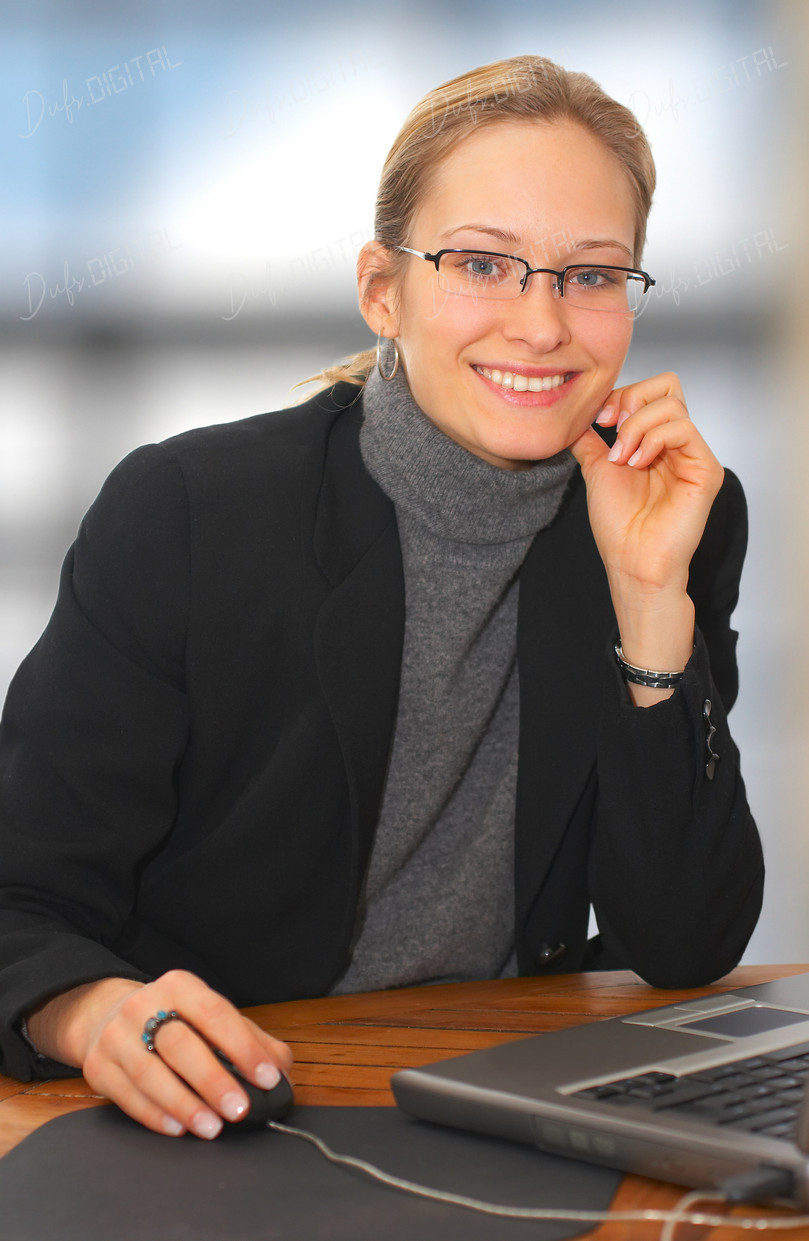 Smiling Businesswoman at Desk