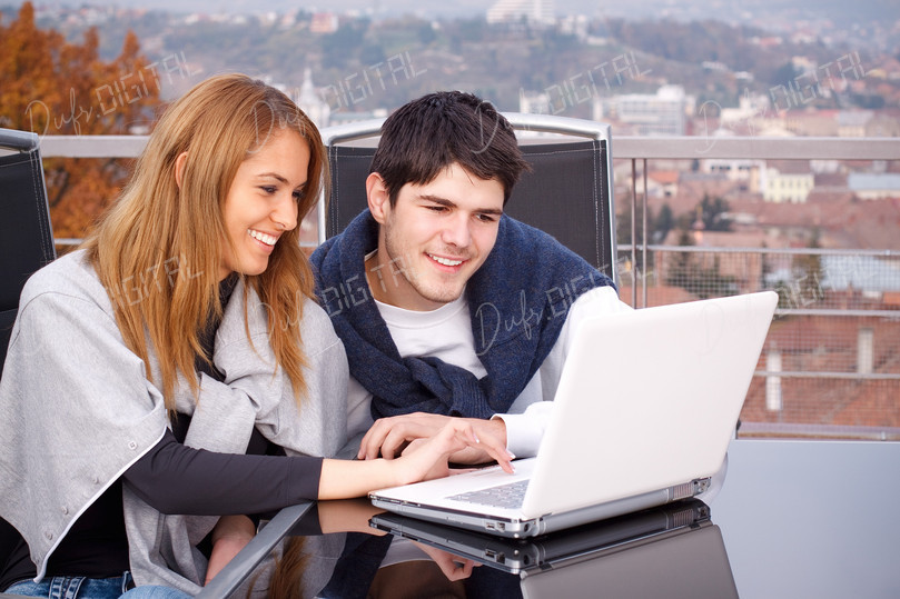 Couple Using Laptop Together