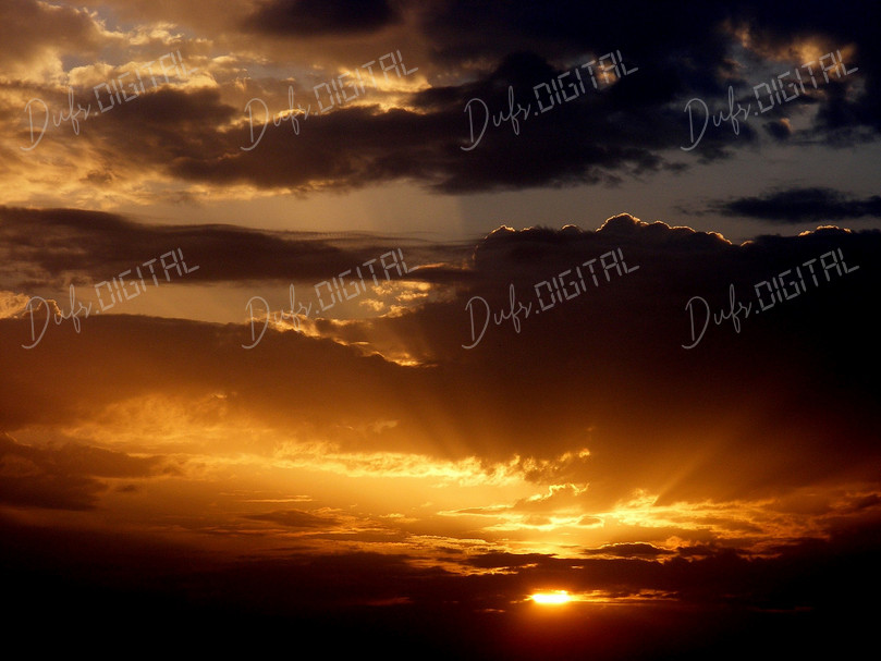 Golden Sunset Over Clouds