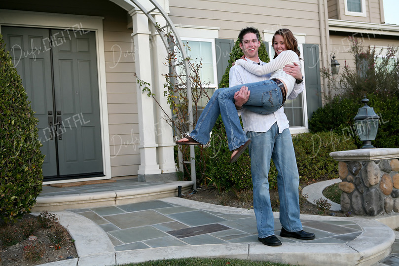 Happy Couple Outside Home