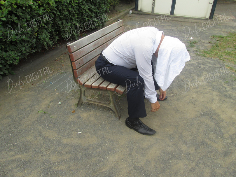 Man Sitting on Bench