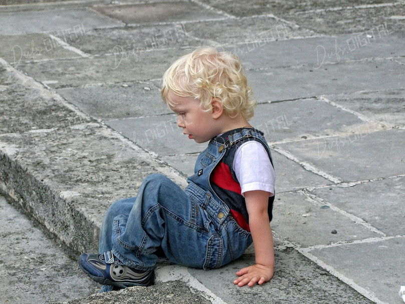 Thoughtful Child Sitting