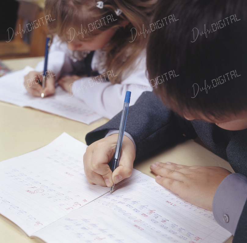 Kids Writing in Notebooks