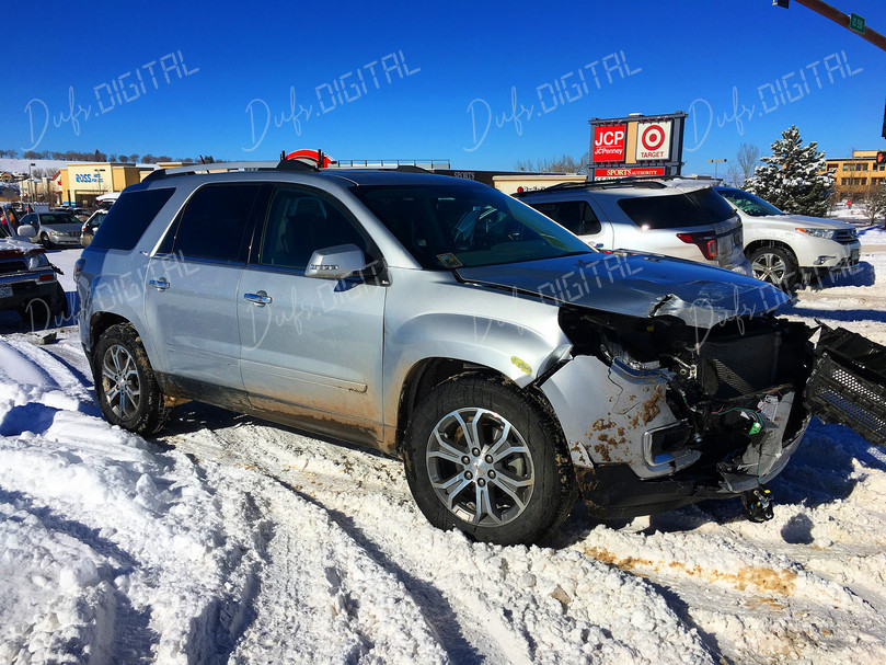Damaged SUV in Snow