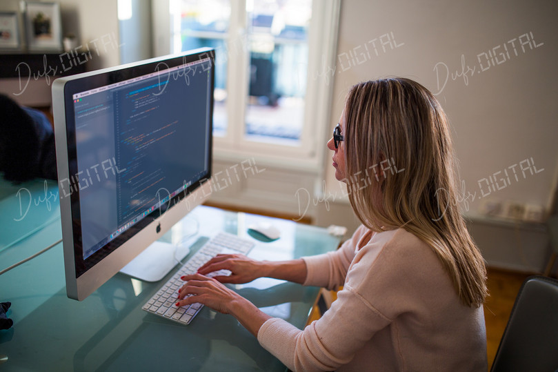 Woman Coding at Computer