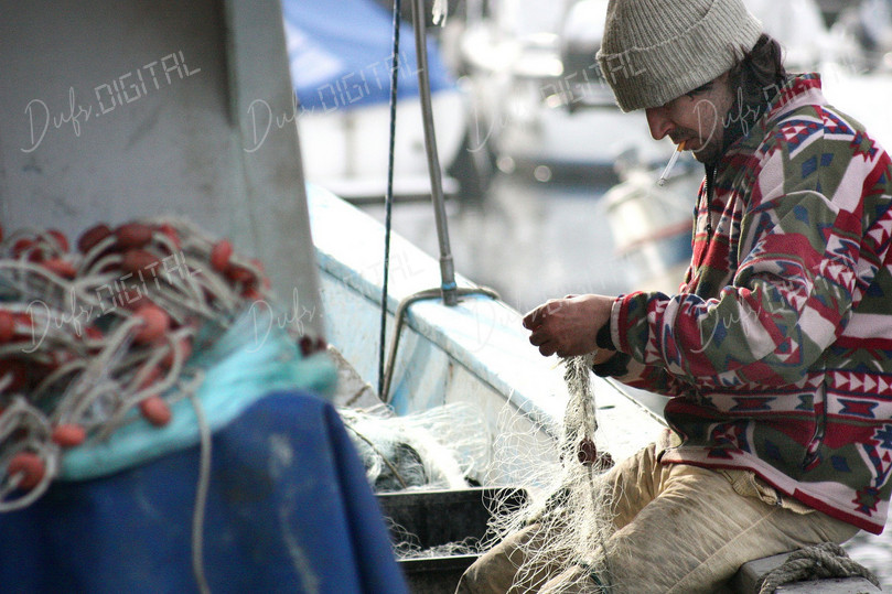 Fisherman Mending Nets
